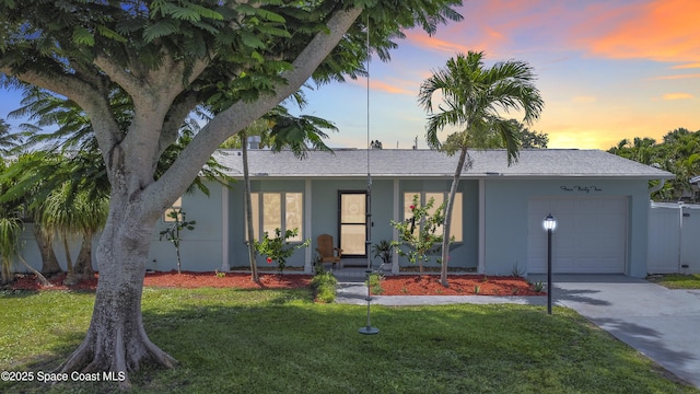 432 N Neptune Dr, Satellite Beach, FL 32937 - ranch-style home featuring an attached garage, driveway, and stucco siding
