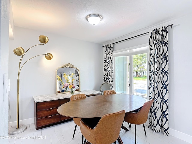 432 N Neptune Dr, Satellite Beach, FL 32937 - dining area with baseboards