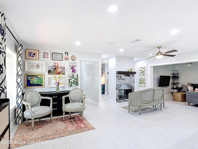 432 N Neptune Dr, Satellite Beach, FL 32937 - living room featuring a premium fireplace, ceiling fan, and recessed lighting