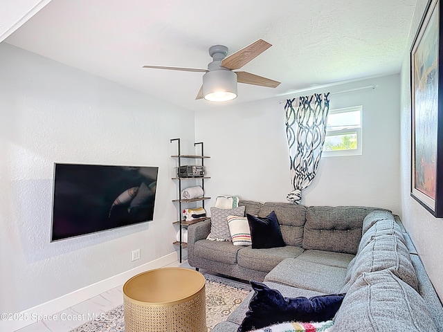 432 N Neptune Dr, Satellite Beach, FL 32937 - living room featuring a ceiling fan and baseboards