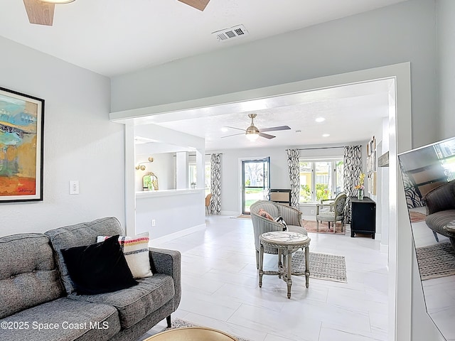 432 N Neptune Dr, Satellite Beach, FL 32937 - living room with a ceiling fan and baseboards