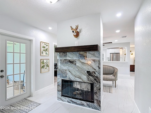 432 N Neptune Dr, Satellite Beach, FL 32937 - detailed view of freestanding refrigerator, a multi sided fireplace, and recessed lighting