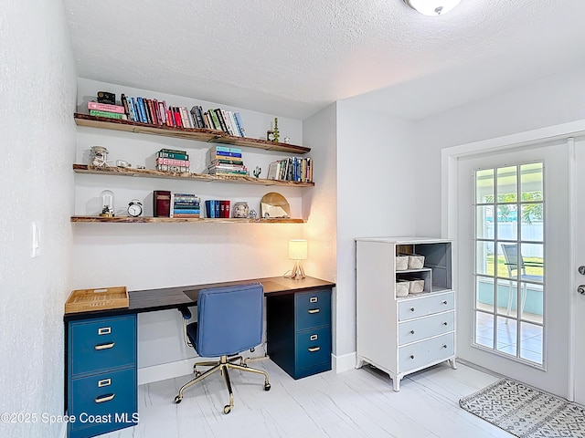 432 N Neptune Dr, Satellite Beach, FL 32937 - office space featuring a textured ceiling and baseboards