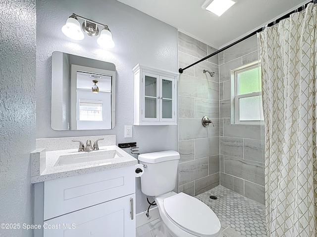 432 N Neptune Dr, Satellite Beach, FL 32937 - full bath featuring vanity, tiled shower, and a textured wall