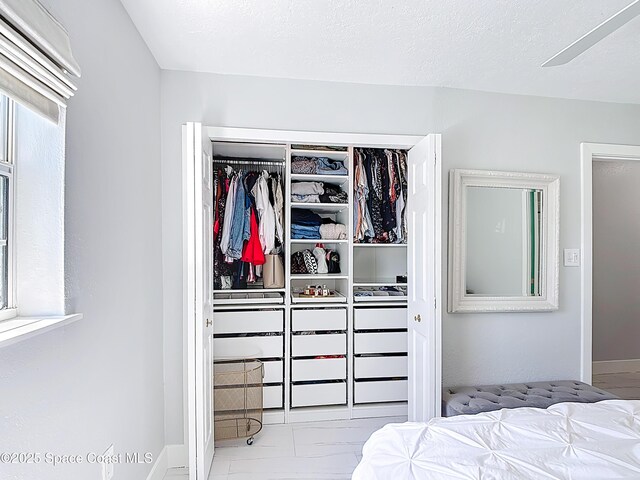 432 N Neptune Dr, Satellite Beach, FL 32937 - bedroom featuring a closet and marble look tile flooring