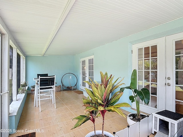 432 N Neptune Dr, Satellite Beach, FL 32937 - sunroom with french doors, healthy amount of natural light, and beam ceiling