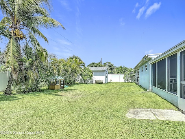 432 N Neptune Dr, Satellite Beach, FL 32937 - fenced backyard with a storage unit