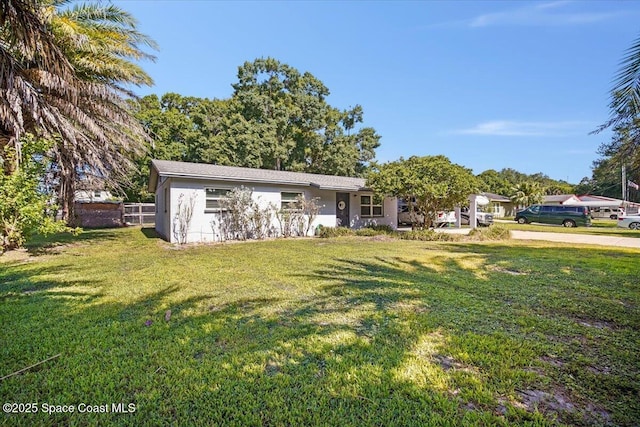 13 Lee St, Cocoa, FL 32926 - view of front of house with a front yard and stucco siding