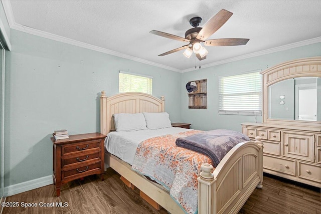 13 Lee St, Cocoa, FL 32926 - bedroom featuring dark wood-style flooring, ornamental molding, a textured ceiling, and a ceiling fan