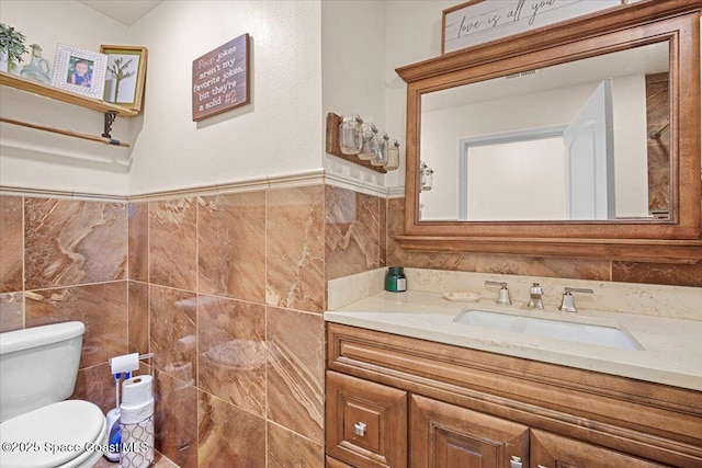 13 Lee St, Cocoa, FL 32926 - half bathroom with tile walls, vanity, and wainscoting