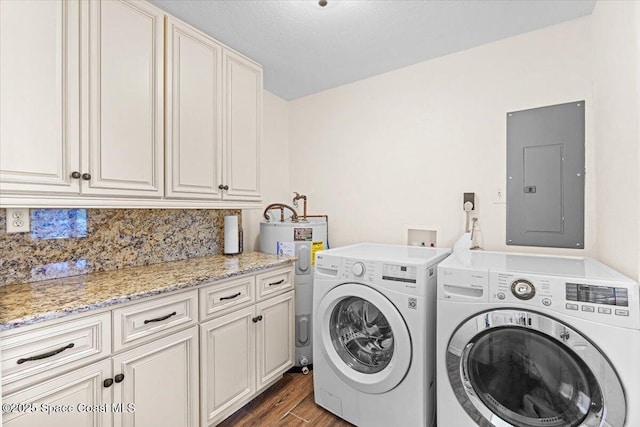 13 Lee St, Cocoa, FL 32926 - laundry room featuring electric panel, separate washer and dryer, cabinet space, electric water heater, and dark wood-type flooring
