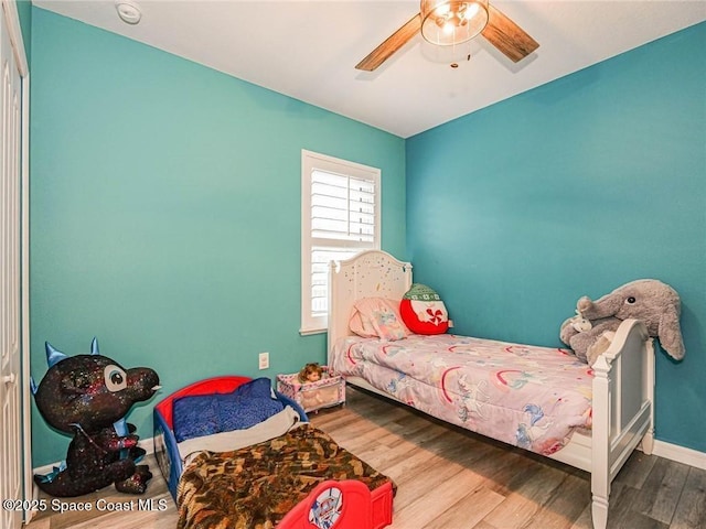 9025 106th Ave, Vero Beach, FL 32967 - bedroom with wood finished floors and a ceiling fan