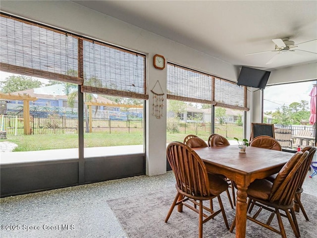 9025 106th Ave, Vero Beach, FL 32967 - sunroom featuring ceiling fan and outdoor dining area