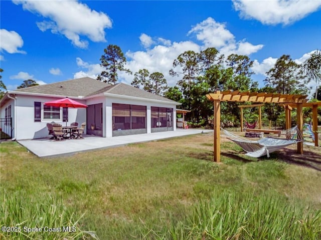 9025 106th Ave, Vero Beach, FL 32967 - back of property featuring a pergola, a patio, stucco siding, and a yard