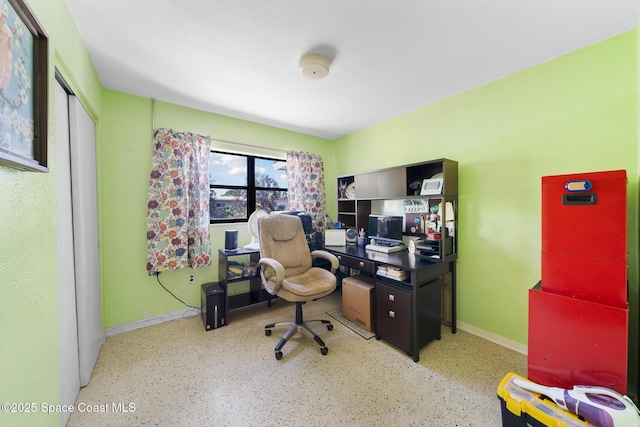 1938 Madison Ave, Melbourne, FL 32935 - home office with baseboards and speckled floor