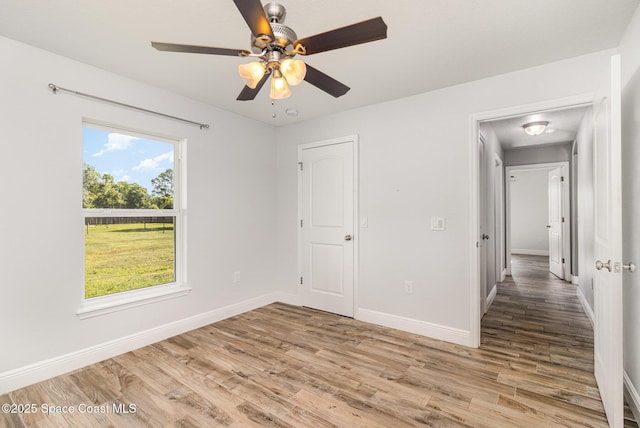 3735 Crista Jean Ave, Grant-Valkaria, FL 32909 - unfurnished bedroom with light wood-type flooring and a ceiling fan