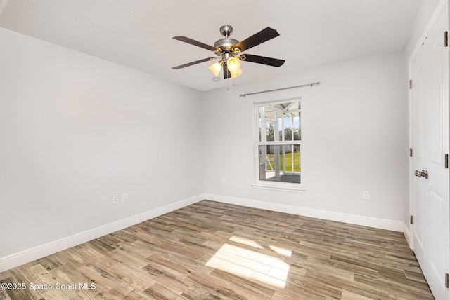 3735 Crista Jean Ave, Grant-Valkaria, FL 32909 - empty room with wood finished floors and ceiling fan