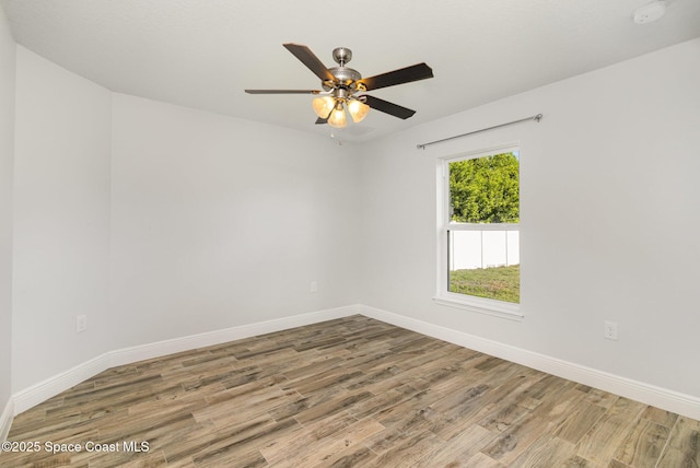 3735 Crista Jean Ave, Grant-Valkaria, FL 32909 - unfurnished room featuring wood finished floors, ceiling fan, and a smoke detector