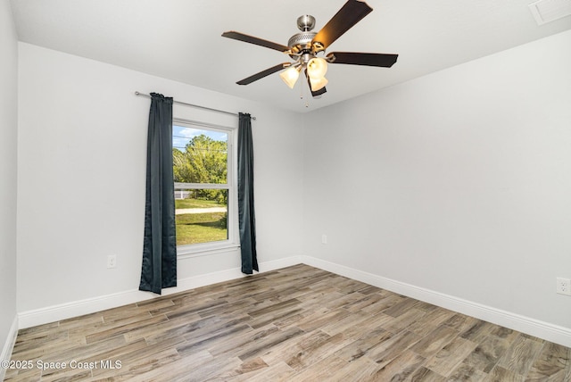 3735 Crista Jean Ave, Grant-Valkaria, FL 32909 - spare room with wood finished floors and a ceiling fan