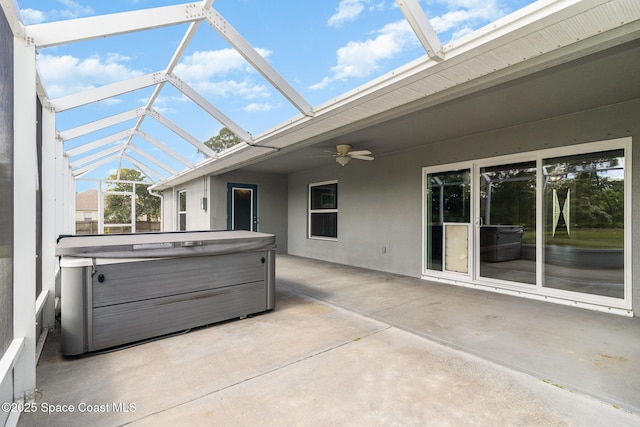 3735 Crista Jean Ave, Grant-Valkaria, FL 32909 - view of patio featuring a hot tub, ceiling fan, and a lanai