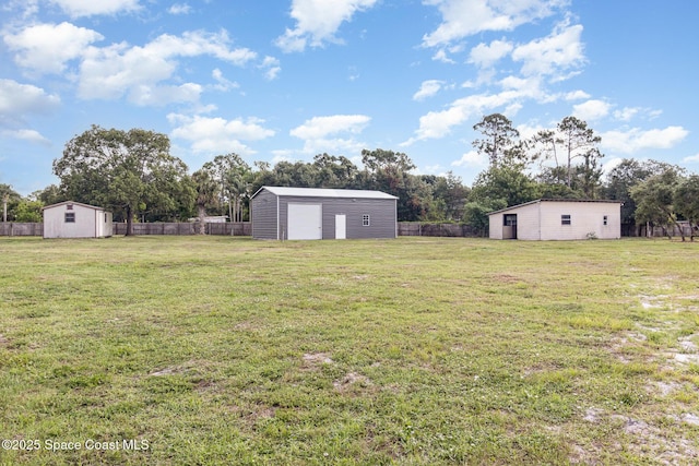 3735 Crista Jean Ave, Grant-Valkaria, FL 32909 - fenced backyard featuring a shed and a garage
