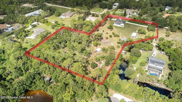 3735 Crista Jean Ave, Grant-Valkaria, FL 32909 - aerial overview of property's location featuring property parcel outlined and a large body of water