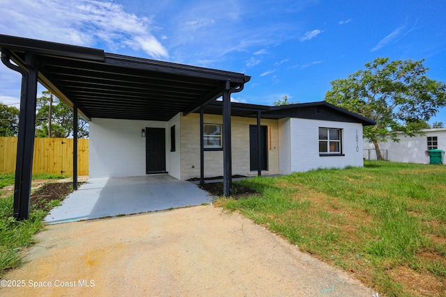 1810 Dixon Blvd, Cocoa, FL 32922 - view of front of home with a carport and concrete driveway