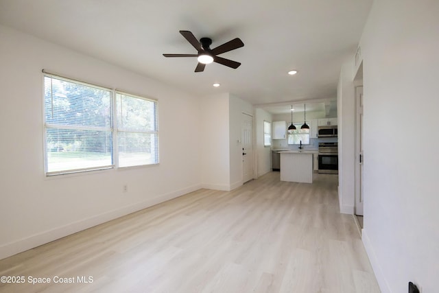 1810 Dixon Blvd, Cocoa, FL 32922 - unfurnished living room featuring ceiling fan, light wood-style floors, and recessed lighting