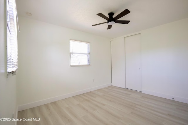 1810 Dixon Blvd, Cocoa, FL 32922 - unfurnished bedroom with light wood-style flooring, a closet, and a ceiling fan