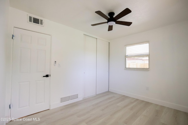 1810 Dixon Blvd, Cocoa, FL 32922 - unfurnished bedroom featuring a closet, light wood-type flooring, and ceiling fan