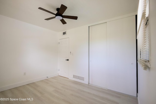 1810 Dixon Blvd, Cocoa, FL 32922 - unfurnished bedroom with light wood-type flooring, a closet, and ceiling fan