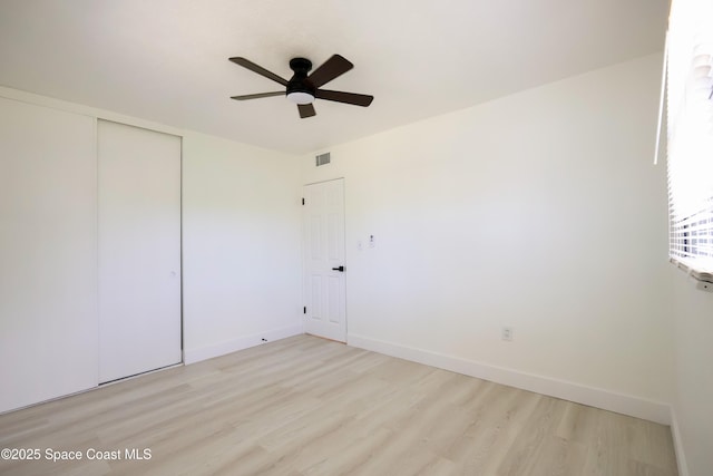 1810 Dixon Blvd, Cocoa, FL 32922 - unfurnished bedroom with light wood-style floors, a closet, and ceiling fan