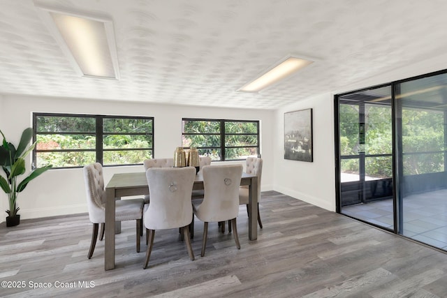 5685 Jamaica Rd, Cocoa, FL 32927 - dining room featuring wood finished floors