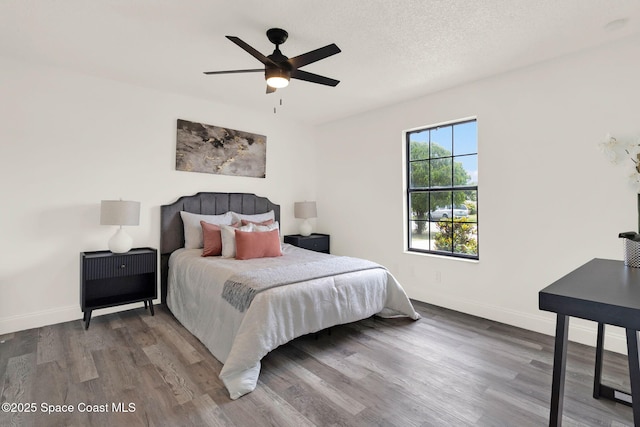 5685 Jamaica Rd, Cocoa, FL 32927 - bedroom with wood finished floors and ceiling fan