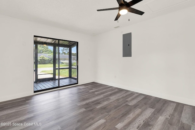 5685 Jamaica Rd, Cocoa, FL 32927 - spare room with electric panel, a ceiling fan, and dark wood-style flooring