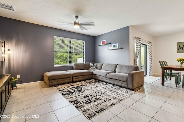 1809 Morely Dr, Cocoa, FL 32926 - living area with light tile patterned floors and ceiling fan