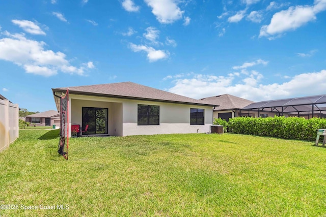 1809 Morely Dr, Cocoa, FL 32926 - back of property with stucco siding and a yard