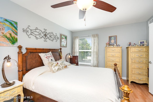 1100 SE Mitchell Ave Unit 204, Port St Lucie, FL 34952 - bedroom featuring wood finished floors and a ceiling fan