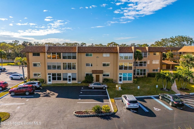 3210 N Harbor City Blvd Unit 316, Melbourne, FL 32935 - view of property featuring uncovered parking
