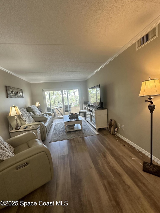 3210 N Harbor City Blvd Unit 316, Melbourne, FL 32935 - living room featuring a textured ceiling, dark wood-style flooring, and crown molding