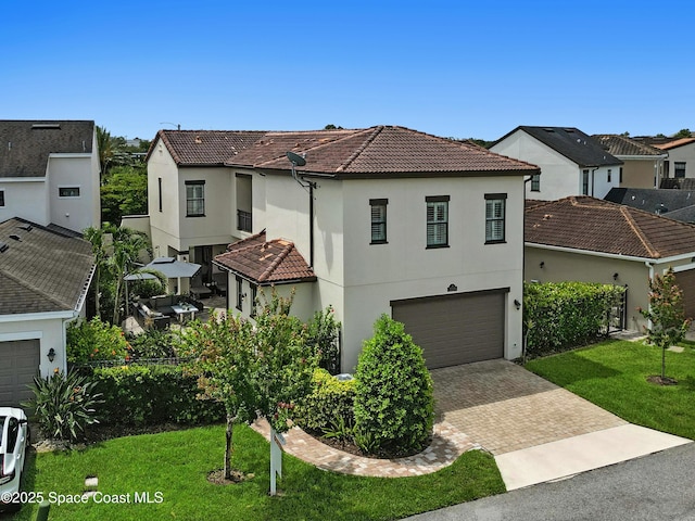 2225 Framura Ln, Melbourne, FL 32940 - view of front of house featuring a tiled roof, driveway, stucco siding, a garage, and a residential view