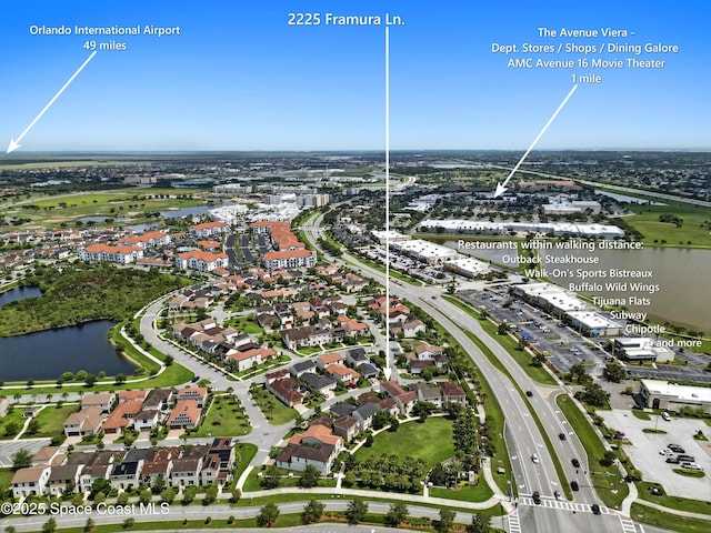 2225 Framura Ln, Melbourne, FL 32940 - aerial view of property and surrounding area featuring a large body of water and nearby suburban area