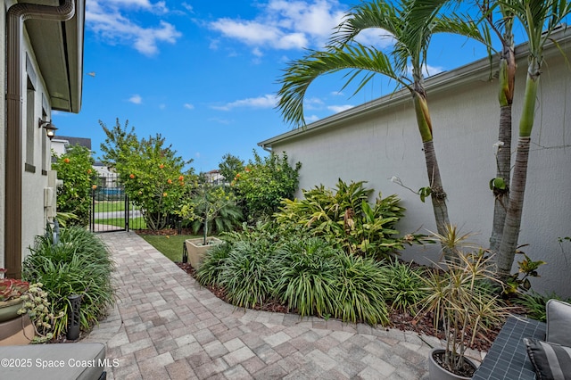 2225 Framura Ln, Melbourne, FL 32940 - view of patio featuring a gate