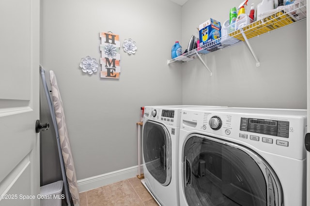 2225 Framura Ln, Melbourne, FL 32940 - washroom with washer and clothes dryer and light tile patterned flooring