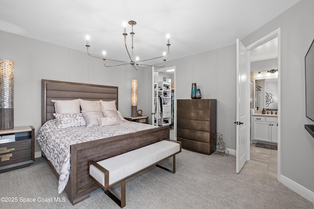 2225 Framura Ln, Melbourne, FL 32940 - bedroom featuring light colored carpet, a chandelier, a spacious closet, a closet, and ensuite bathroom