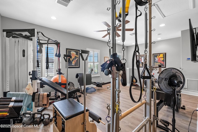 2225 Framura Ln, Melbourne, FL 32940 - workout area featuring a ceiling fan, wood finished floors, and recessed lighting