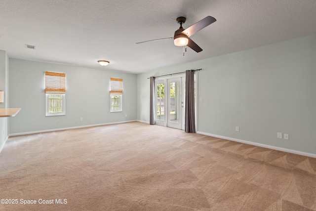 47 Anchor Dr, Indian Harbour Beach, FL 32937 - unfurnished room with a ceiling fan, light colored carpet, and a textured ceiling