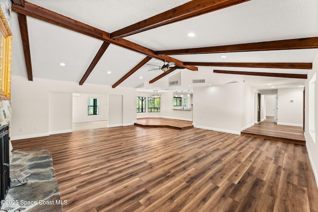 2150 Winston Dr, Cocoa, FL 32926 - unfurnished living room with a fireplace with raised hearth, wood finished floors, a ceiling fan, and recessed lighting