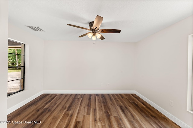 2150 Winston Dr, Cocoa, FL 32926 - empty room with dark wood finished floors and ceiling fan