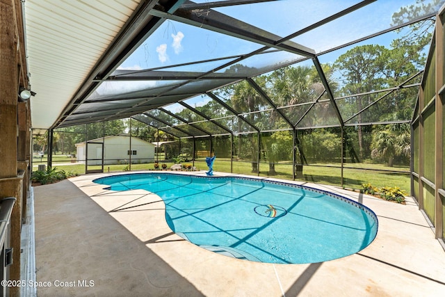 2150 Winston Dr, Cocoa, FL 32926 - outdoor pool featuring a patio area, a shed, a lawn, and glass enclosure